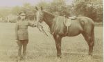 Post WWI Gunner (He has artillery collar badges and lanyard on the right - thanks to Great War Forum for info) at Fort Fareham. A portion of the Officers' Mess can just be seen in the left background.