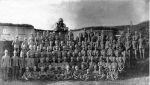 Fort Gomer: Infantry training for South Africa posing in front of a 64pr RML on the Left Face c1900-1901
